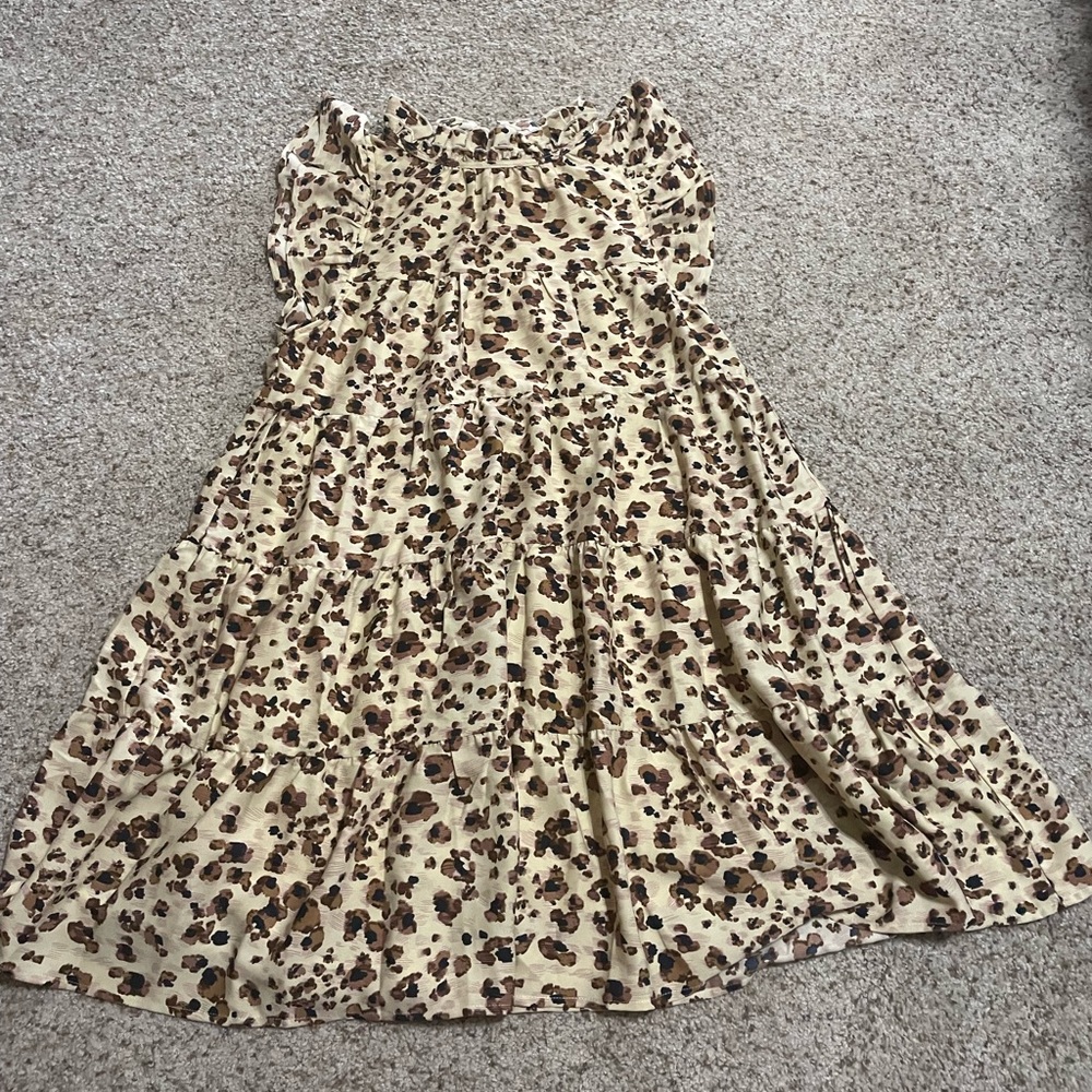Precious lined dress that ties in the back at the neck. Worn once!